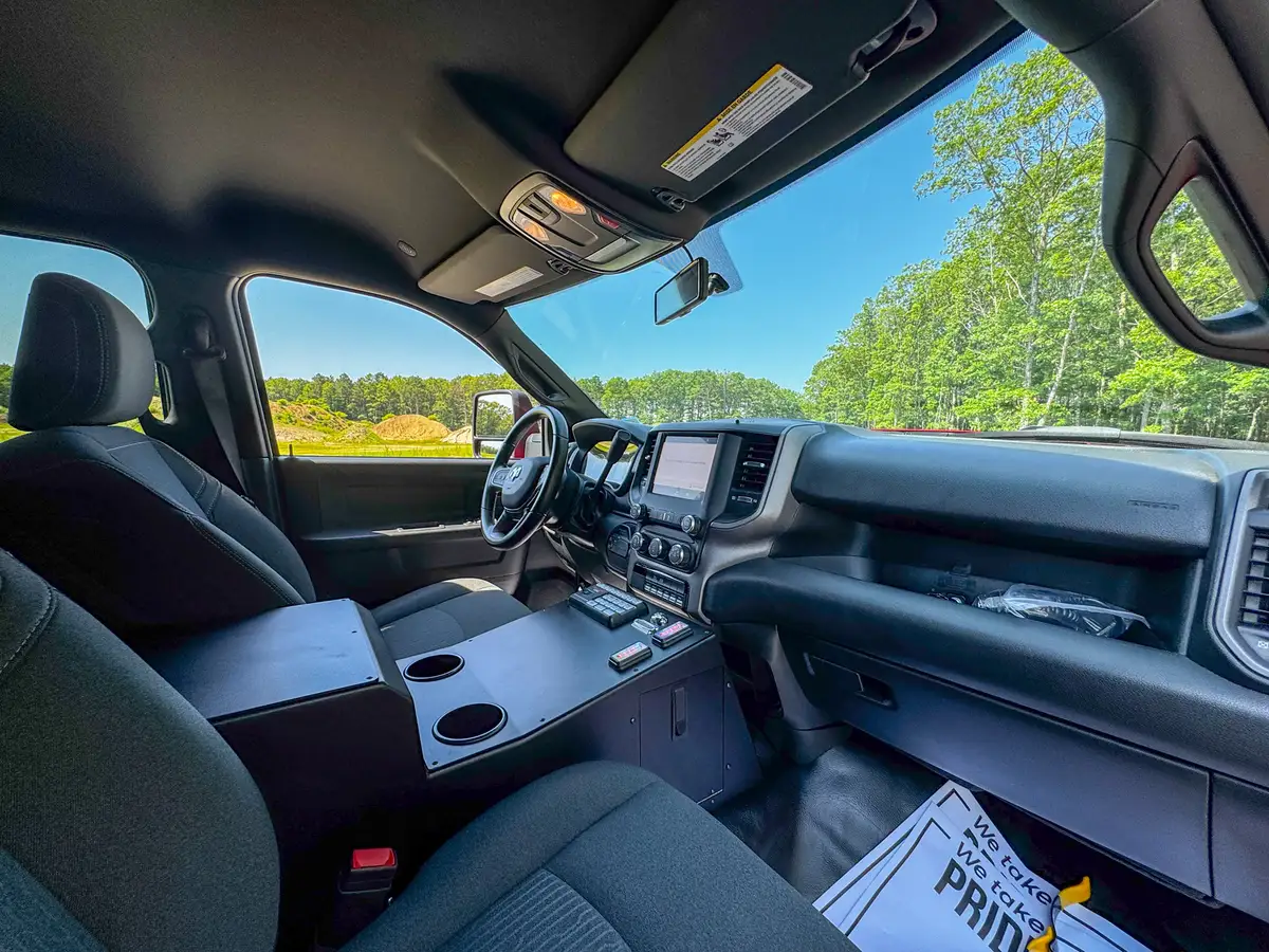 Front passenger-side interior angle showing dash, glovebox, and center controls.